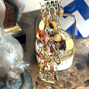 Bracelet designer five strands amber color beads antique hammered brass toggle